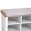 Functional white bench ideal for entry halls.