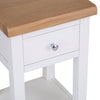 Versatile white lamp table for various rooms.