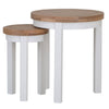 Compact and stylish white round nesting tables.