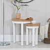 Functional and fashionable white round nesting tables.
