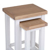 Modern white nest of tables for multifunctional use.