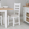 Timeless white chair with ladder-back silhouette.