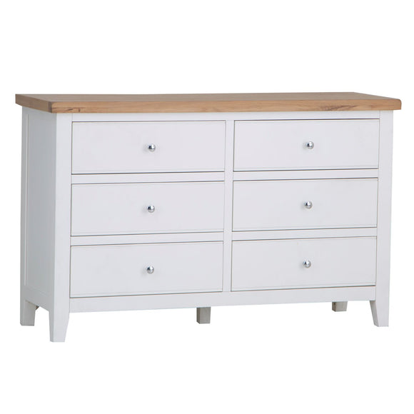 Upgrade your storage with a wide and sleek white dresser.