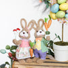 Adorable Easter decor – bunny figurine with carrots, perfect for displays.

