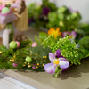 Beautiful holiday’s ornament with flowers and decorative eggs.