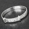 Equilibrium Silver Plated Christening Bangle close view picture on the dark background