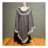 Grey faux fur poncho for women in stylish design.
