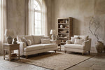 Fletcher Snuggle Chair in Cream shown from the side (2)