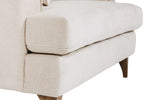 Fletcher Snuggle Chair in Cream shown from the side (9)