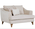 Fletcher Snuggle Chair in Cream shown from the side (3)