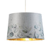 Stunning Flower Drum Shade with Gold Inner elevates your lamp’s shade.