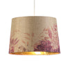 "Elegant flower drum shade with a floral and golden innen design for stylish lighting."
