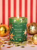 Frosted Woods Medium Scented Candle styled in a festive room setting