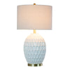 Elegant ceramic lamp with a white geometric pattern and golden accents
