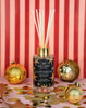 Glittering Gold Reed Diffuser 100ml styled in a festive room setting