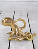 Add a touch of sophistication with the gold octopus wine bottle holder.