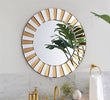 "Stylish Gold Mirror GD001 creating an illusion of space"

