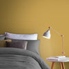 Moody mustard wall paint adds depth to any space.
