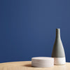 Premium wall paint in sophisticated navy blue.

