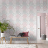 Pink geometric wallpaper featuring a stunning hexagonal design by Graham & Brown.

