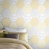 Elegant yellow geometric wallpaper with metallic accents for stylish walls.
