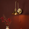 Hadano Wall Light Natural Brass and Aged Brass life style picture
