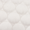 Scatterbox Cushion Halo Cream with a soft geometric stitching