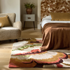 Harlequin Calathea Floral Rug Amber/Brazilian Rosewood lifestyle picture in the living room