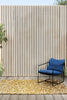 Harlequin Melodic Outdoor Rug Ochre Gold lifestyle picture outside