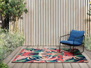 Harlequin Melora Outdoor Rug Pink lifestyle picture outside