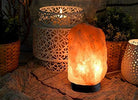 Large crystal salt lamps radiating warm orange hues

