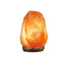 Softly glowing salt lamps in natural rock form

