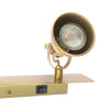 Idaho 2 Light Wall Spotlight Natural Brass close view picture of the shade and switcher rocker