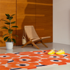 Marimekko Unikko Floral Rug Orange Red lifestyle picture in the living room