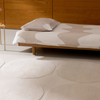 Marimekko Isot Kivet Geometric Rug Natural White lifestyle picture in the bedroom