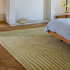 Marimekko Kalasääski Geometric Rug Light Green lifestyle picture in the bedroom