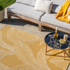 Marimekko Kukat Puhkeavat Outdoor Floral Rug Straw lifestyle picture outside