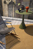 Brink & Campman Lace Outdoor Rug Golden Mustard/Grey Taupe lifestyle picture on the balcony