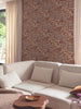 Liege Rust Leaf Wallpaper hung in a styled room setting