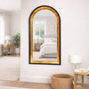 Limehouse Arched Mirror Black & Gold lifestyle picture in the bedroom