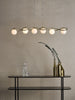 Lysandra 6 Light Bar Pendant Polished Gold and Opal Glass life style picture