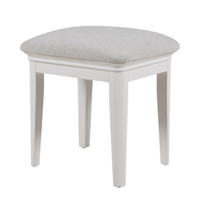 Chic stool for grooming routines.