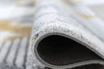 Mason Geometric Rug 110 Grey Mustard close view picture of the rug bordered end