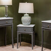 Monroe 1 Drawer Accent Table Russel picture with a table lamp on it