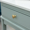 Monroe Coffee Table With Marble Top Sage with a gold knob handles on the drawer