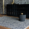 Brink & Campman Nest Plain Rug Ink lifestyle picture in the dining room