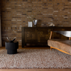 Brink & Campman Nest Plain Rug Leather life style picture in the living room