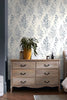 Brighten Your Space with Leaf Sprigs Blue Wallpaper