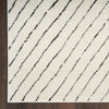 Nourison Modern Comfort Rug MNC01 Ivory Black with a stripped pattern