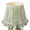 Omer Table Lamp Matt Green and Antique Brass With Shade close view picture of the green checkered design with a bow